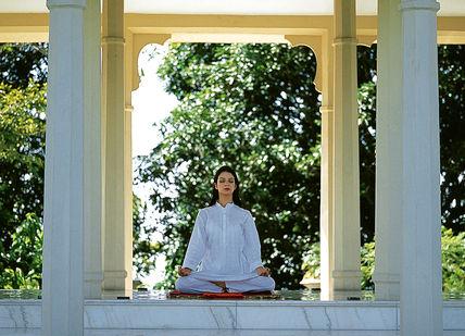 An image of a woman doing yoga, Yoga Retreat Programme. Ananda in the Himalayas