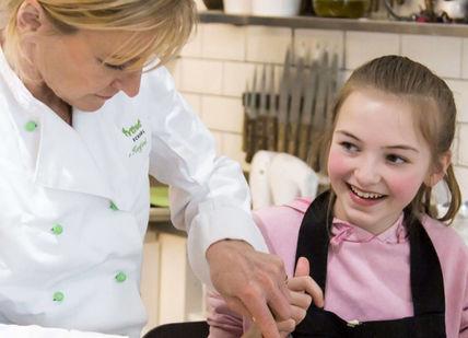 An image of a woman and a little girl in a kitchen, Children’s Cooking Class. Avenue Cookery School