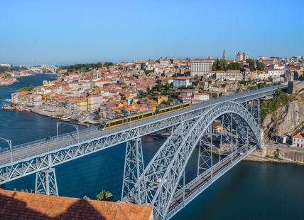 An image of a bridge over a river, 3-nigh stay at a 5-star hotel in central Oporto.