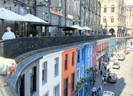 An image of a city street with people walking, Private Royal Mile Old Town Tour and Indian Dinner. Rishi's Edinburgh Tours