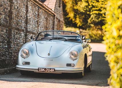 An image of a car parked in a driveway, Speedster.  RNG Classics