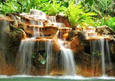 An image of a waterfall in the jungle, Luxury Eco-Lodge Break. Activated Life Experiences
