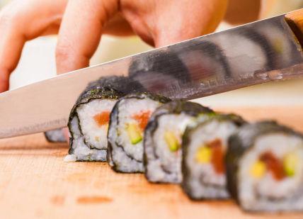 An image of someone cutting a sui, Fushi Sushi Class. Avenue Cookery School