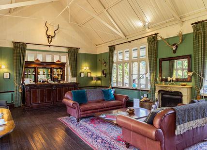 An image of a living room with a fireplace, Clay Pigeon Shooting Near London. Bisley Shooting Ground