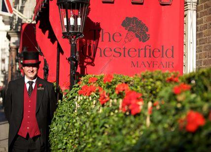 An image of a man in a suit and hat, Chesterfield Mayfair Hotel. Chesterfield Mayfair Hotel