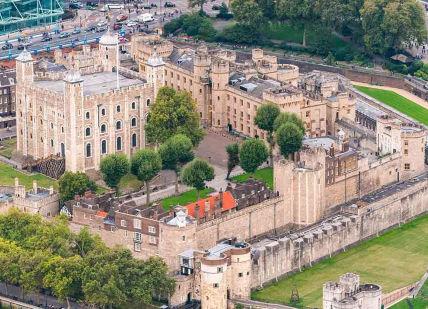 An image of a castle in the middle of a city, Two admission tickets to the Tower of London. Historic Royal Palaces