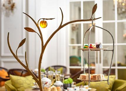 An image of a table setting with a cake, Teamaster's Afternoon Tea. Mandarin Oriental - The Rosebery
