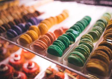 An image of a display of colorful pastries, Private Confectionary Tasting. Pierre Hermé