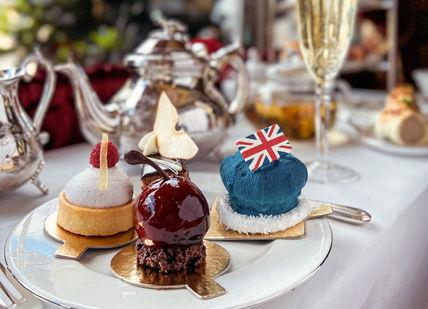 An image of a dessert on a plate, Royal Afternoon Tea. The Rubens at the Palace - The Palace Lounge