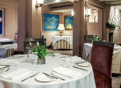 An image of a restaurant with tables and chairs, Three-Night Romantic Getaway. The Xara Palace