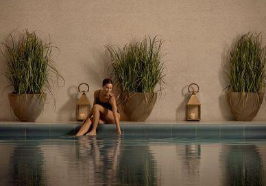 An image of a person sitting in the swimming