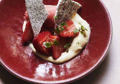 An image of a plate of food on a table, Four-Course Tasting Menu with Paired Wines. Cigalon