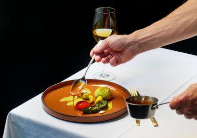 An image of a plate of food on a table, Six-Course Tasting Menu. Club Gascon