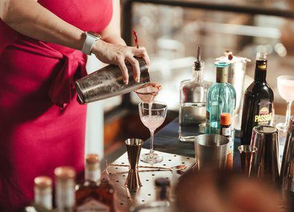 An image of a person making a cocktail
