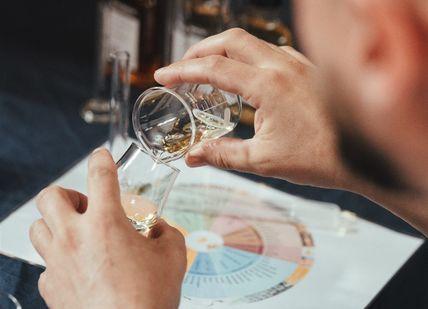 An image of person making whisky