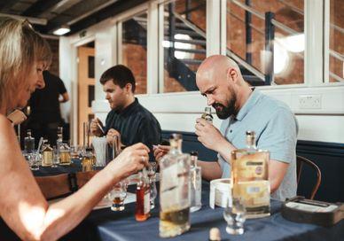 An image of people of people on a whisky blending class