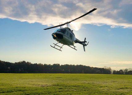 An image of B206 Jet Ranger flying