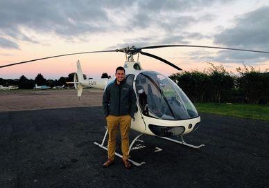 A person standing in front od Guimbal Cabri G2 helicopter