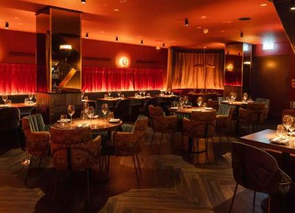 An image of an interior of restaurant, tables with chairs. Gaucho Covent Garden