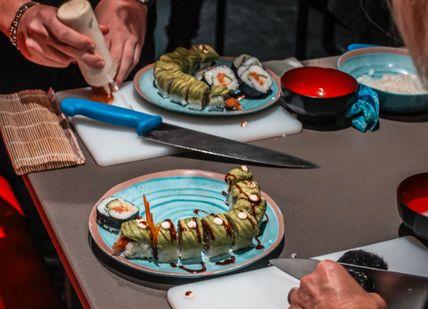 An image of a person preparing sushi