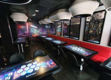 An image of a front room with interactive tables at Inamo Soho