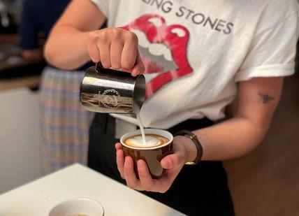A person making latte