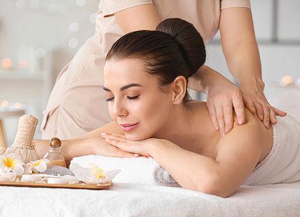 An image of a woman getting a massage, Day spa delight. Luenire