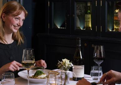 An image of 2 people having a dinner at The Roseate Edinburgh hotel