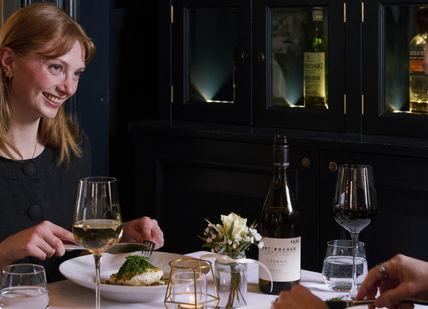 An image of 2 people having a dinner at The Roseate Edinburgh hotel