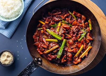 A plate with a dish. School of Wok