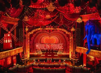 An image of a stage with red curtains and a stage with a stage set, Tickets for Moulin Rouge. The Ticket Machine Group Ltd