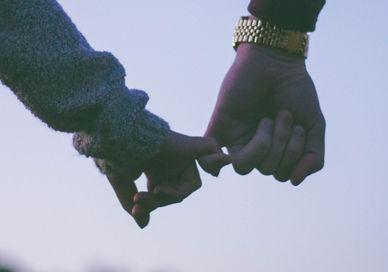 An image of a couple holding hands, Capture Your Love Story. Vandercom Films