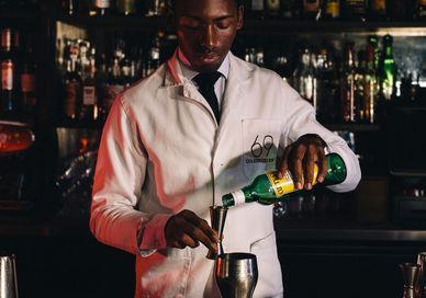 An image of a man pouring a drink, Cocktail Masterclass. 69 Colebrooke Row