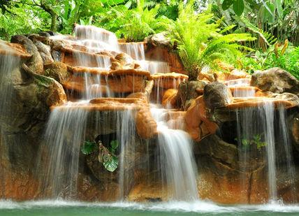 An image of a waterfall in the jungle, Luxury Eco-Lodge Break. Activated Life Experiences