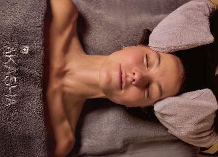 An image of a woman taking massage Weekday Escape Package. Akasha Holistic Wellbeing Centre at Hotel Cafe Royal