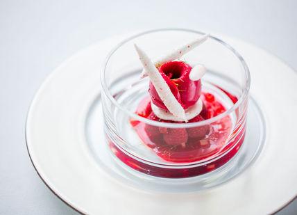 An image of a dessert with a strawberry on top, Three Michelin Starred Vegetarian Menu. Alain Ducasse at The Dorchester