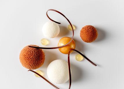 An image of three desserts on a white surface, 5-course tasting menu. Alex Dilling at Hotel Cafe Royal