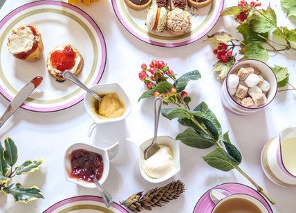 An image of a table with a variety of desserts, Laurent-Perrier Afternoon Tea Experience. Alexander House Hotel