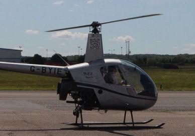 An image of a helicopter on the ground, 60 minute helicopter and plane flight. Almat Flying Academy