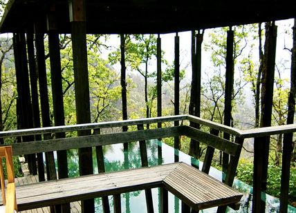 An image of a balcony with a chair, Yoga Retreat Programme. Ananda in the Himalayas