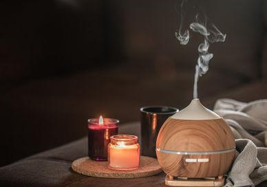 An image of a wooden diffuse diffuser with a candle and a tea light, Absolute Spa Ritual for Her. Aurora Wellbeing Spa