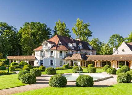 An image of a house in the middle of a garden, Return airport transfers from Dijon to Beaune. Authentica Tours