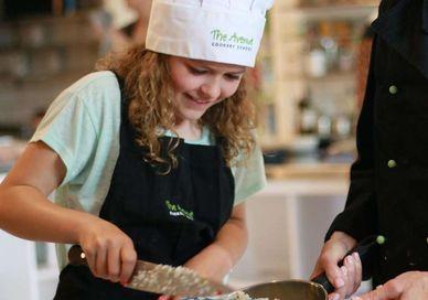 An image of a woman and a child in a kitchen, Children’s Cooking Class. Avenue Cookery School