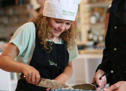 An image of a woman and a child in a kitchen, Children’s Cooking Class. Avenue Cookery School