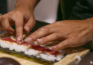 An image of a person cutting sui, Sushi And Cocktail Class. Avenue Cookery School