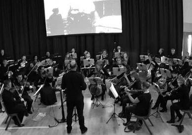 An image of a large room with people, Aylesbury Symphony Orchestra. Aylesbury Symphony Orchestra