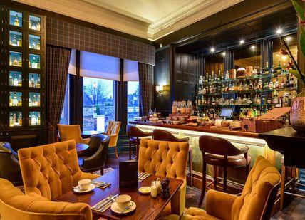 An image of a bar with chairs and a table, Single Malt Whisky and Cheese Pairing. Ba'Bar at The Dunstane Houses