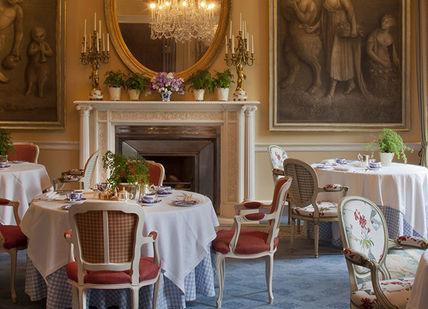An image of a restaurant setting with paintings, Escape to Ireland's Grandest Country House. Ballyfin
