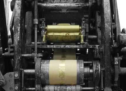 An image of a machine that is working on a piece of metal, Create a Bespoke Stationery Set. Barnard & Westwood