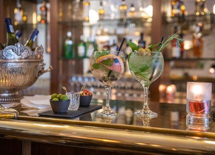 An image of a bar with a variety of drinks, Gin O’clock Sharing Platter. Bbar London